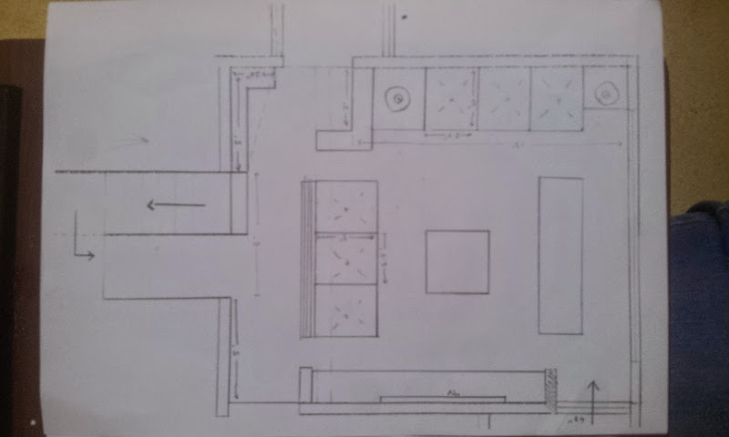 Hand-drawn architectural floor plan on paper