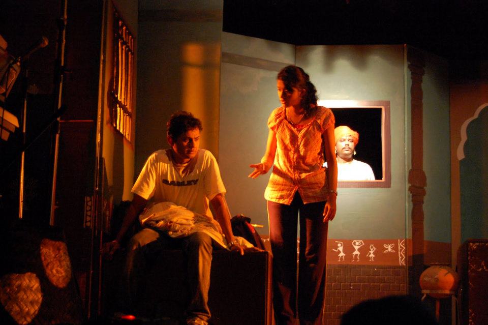 A scene from the play: three characters on stage