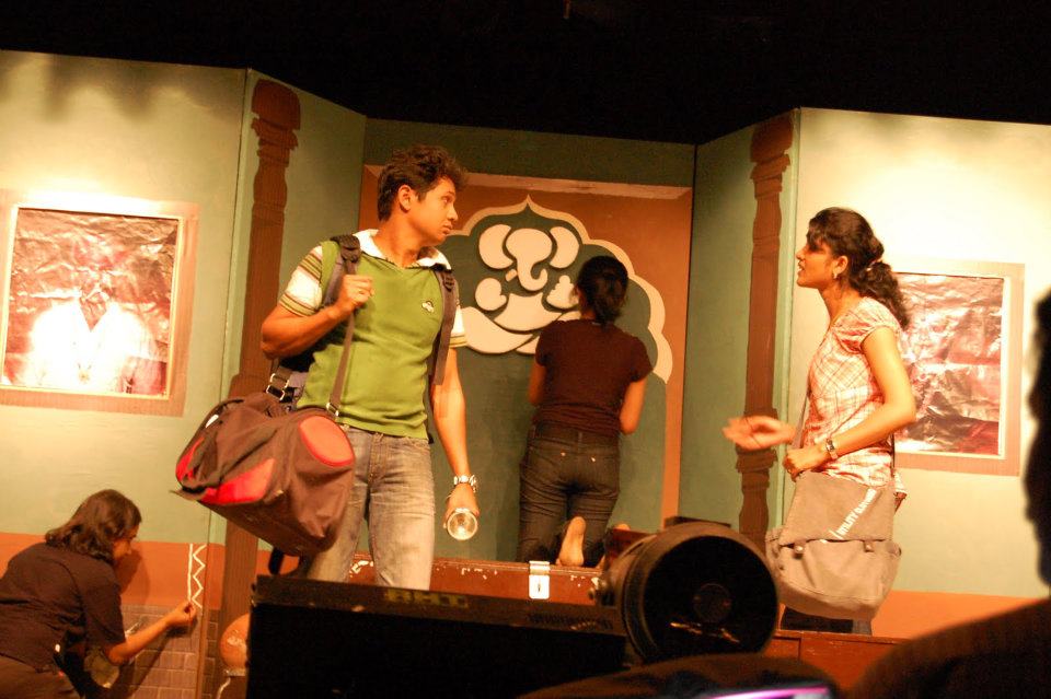 A scene from the play: confrontation with bag in hand